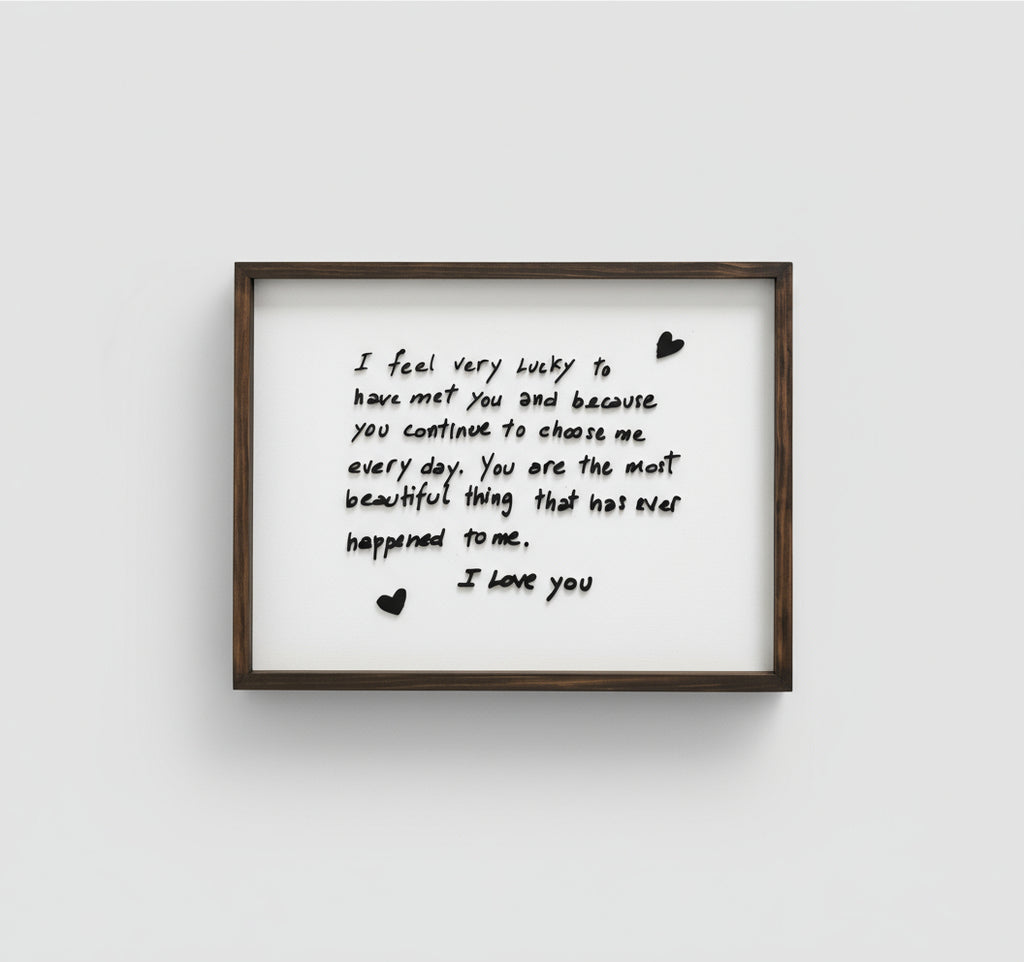 Framed print with a romantic message on a white wall