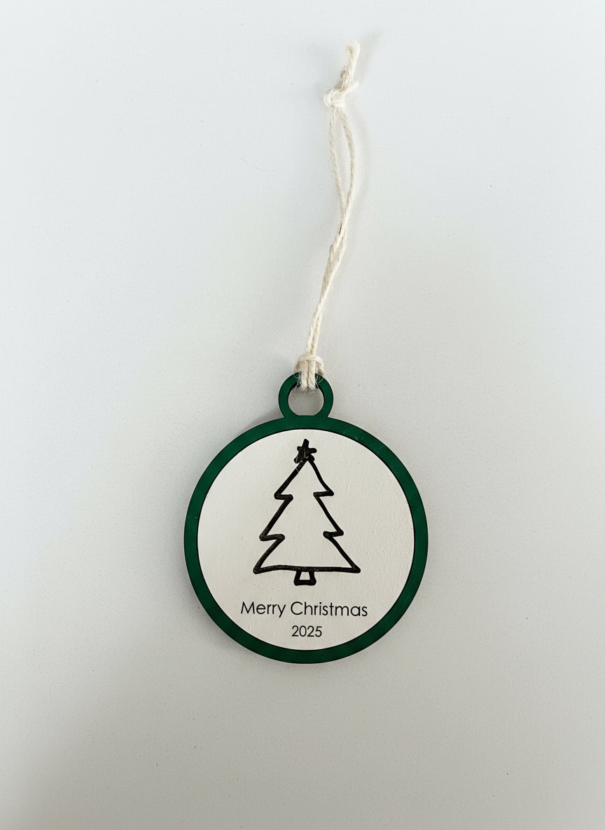 Round Christmas ornament with tree design and 'Merry Christmas 2025' text on a white background